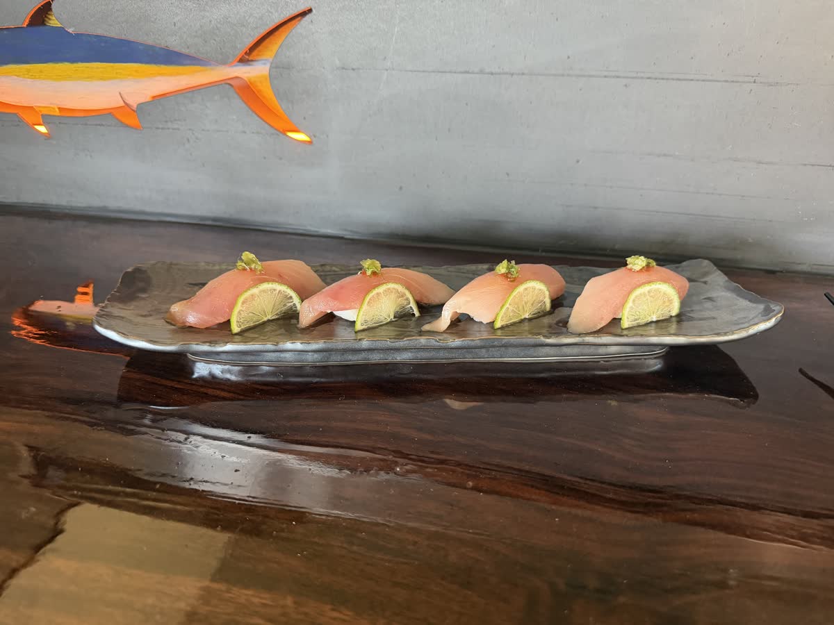 Albacore nigiri on the live-edge sushi counter at Costa Fuego