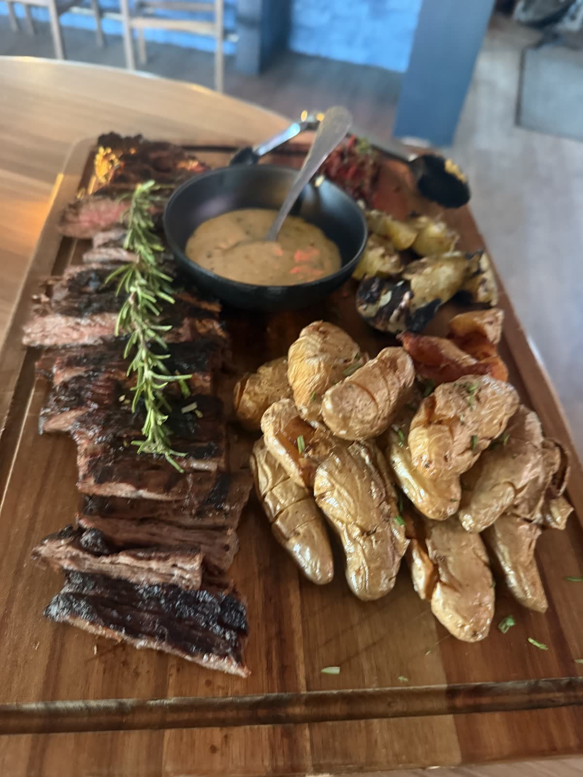 Wood-fired steak board with fingerling potatoes from the Costa Fuego kitchen